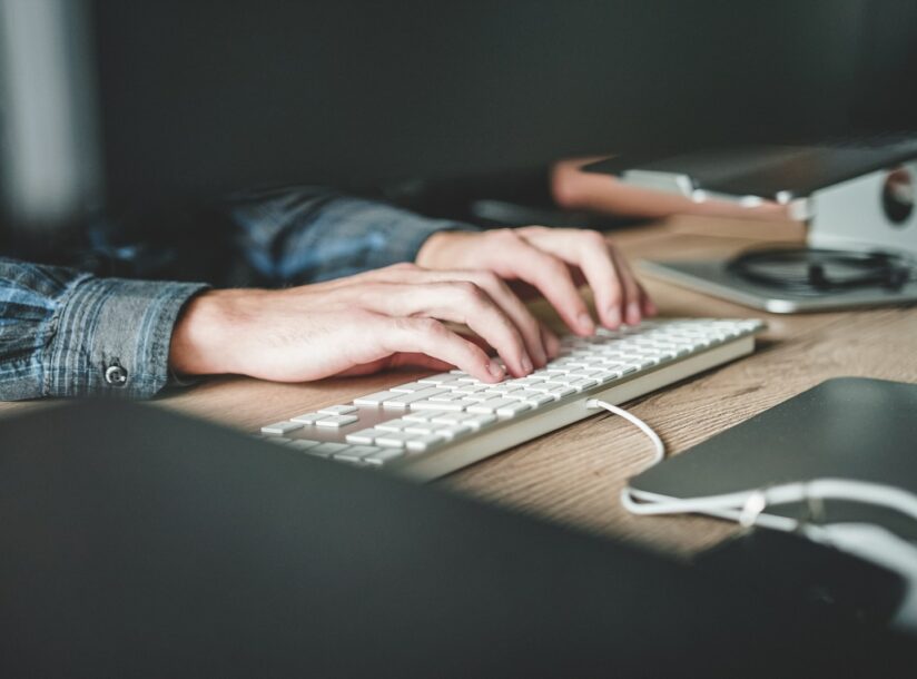 person using computer keyboard